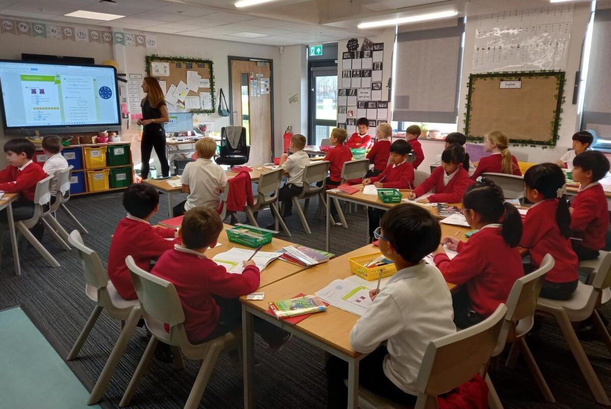 a full classroom of Bingham pupils listening to their teacher